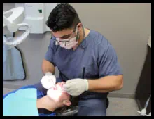 Dr. Philip Lubus examining a patient at Lubus Family Dentistry