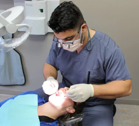 Dr. Philip Lubus examining a patient at Lubus Family Dentistry in Sarnia